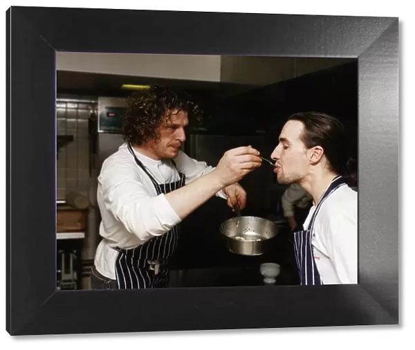 Marco Pierre White Michelin starred chef seen here in his kitchen getting a fellow chef
