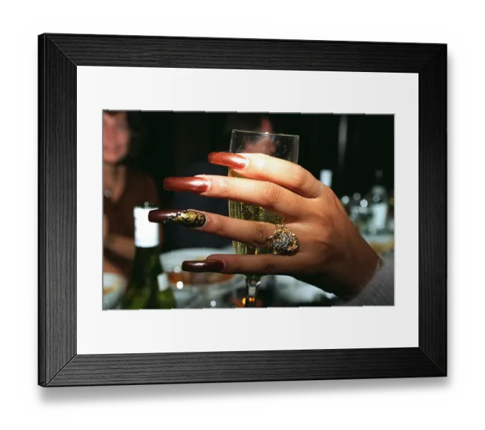 Framed Print : Divines Browns hand on a champagne glass