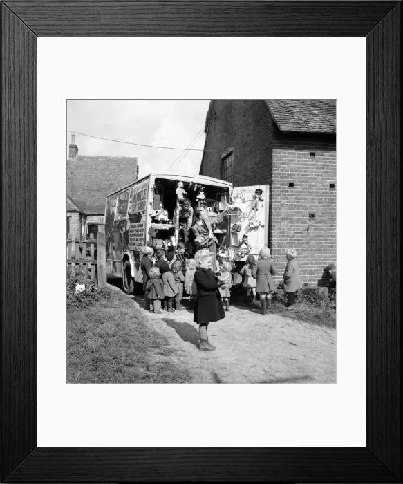 Framed Print : Children look at goods on display at a Mobile Toy Shop - in Kent Framed Print : Children look at goods on display at a Mobile Toy Shop - in Kent