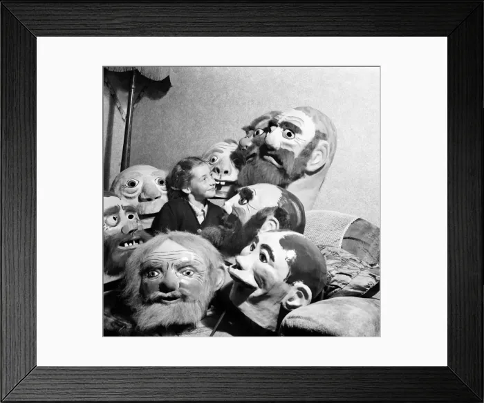 Framed Print : Girl surrounded by ugly masks September 1952 C4445 Framed Print : Girl surrounded by ugly masks September 1952 C4445