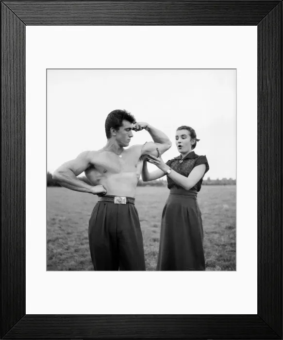 Framed Print : Strongman Spencer Churchill seen here posing by the Pool with Gloria Wagdin