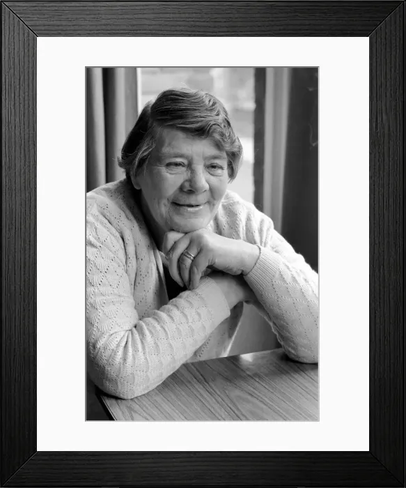 Framed Print : British family feature: A grandmother sitting at her dining table Framed Print : British family feature: A grandmother sitting at her dining table