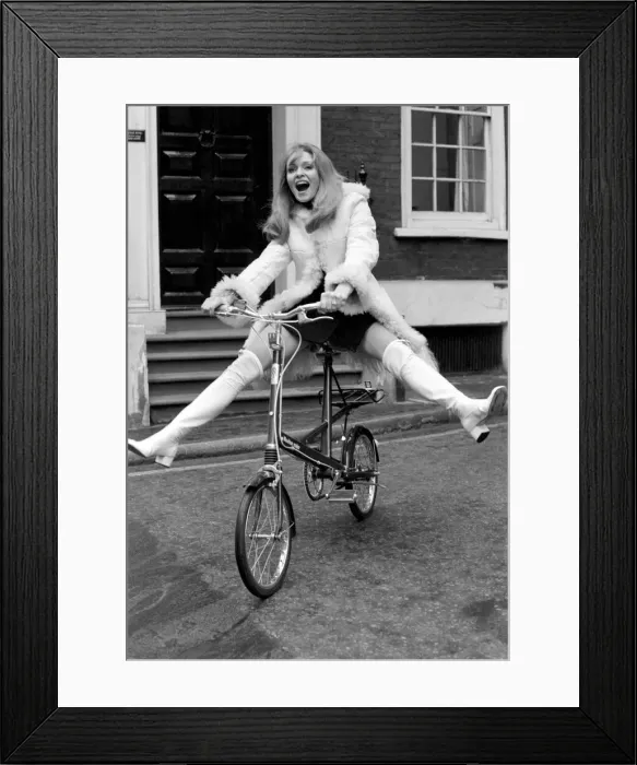 Framed Print : Model Blanche Webb wearing a fur jacket, riding a bicycle. November 1969 Z11350-015 Framed Print : Model Blanche Webb wearing a fur jacket, riding a bicycle. November 1969 Z11350-015