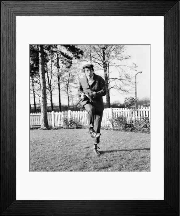Framed Print : Comedian Jack Douglas (42) takes his guns with him wherever he travels, all over England