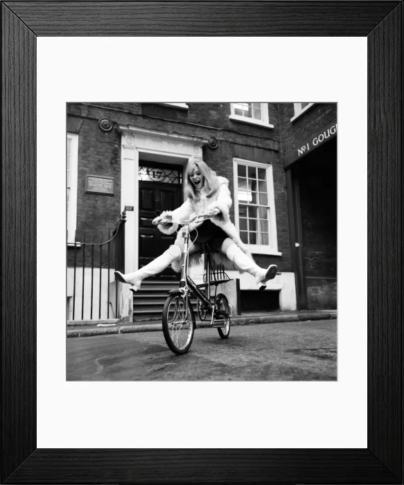 Framed Print : Model Blanche Webb wearing a fur jacket, riding a bicycle. November 1969 Z11350-002 Framed Print : Model Blanche Webb wearing a fur jacket, riding a bicycle. November 1969 Z11350-002