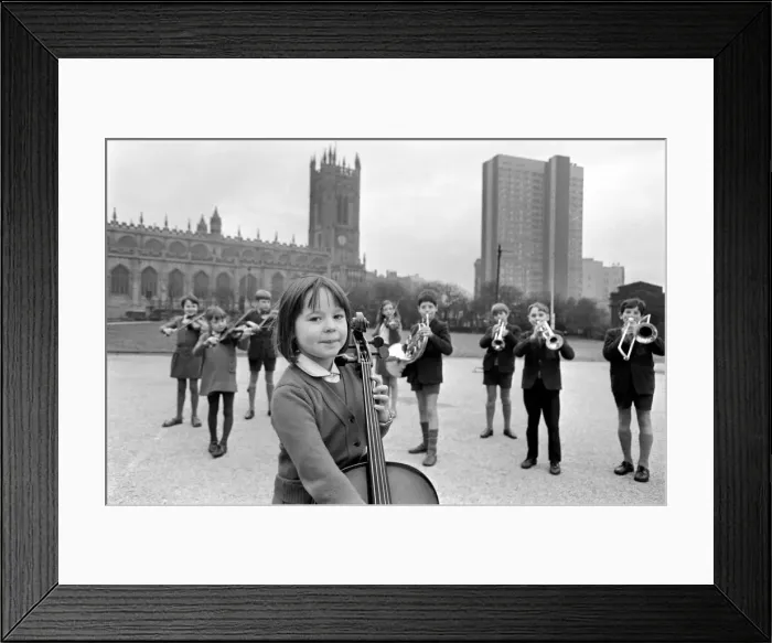 Framed Print : Michaela Milone, a cello player with members of her school band Framed Print : Michaela Milone, a cello player with members of her school band