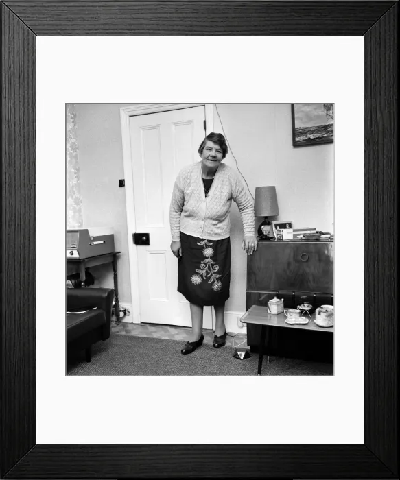 Framed Print : British family feature: A grandmother standing in her living room November 1969