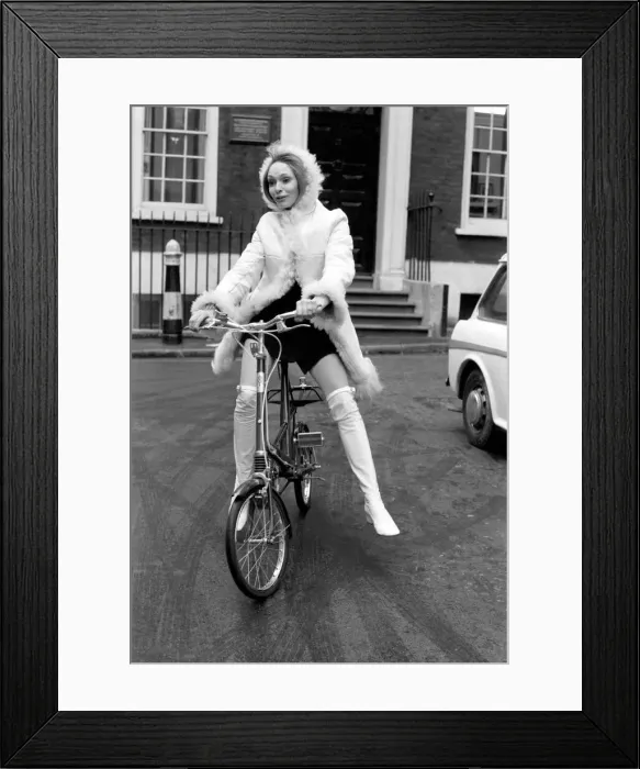 Framed Print : Model Blanche Webb wearing a fur jacket, riding a bicycle. November 1969 Z11350-004 Framed Print : Model Blanche Webb wearing a fur jacket, riding a bicycle. November 1969 Z11350-004