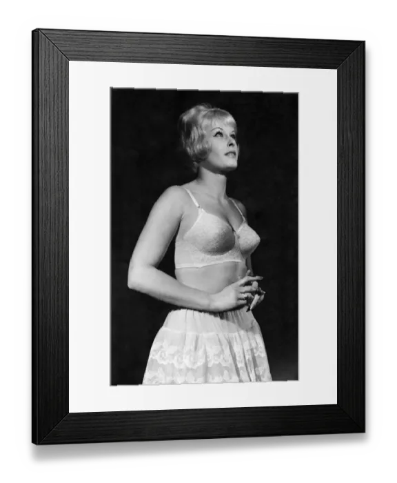 Framed Print : Woman wearing a bra and skirt January 1962 P018252 Framed Print : Woman wearing a bra and skirt January 1962 P018252