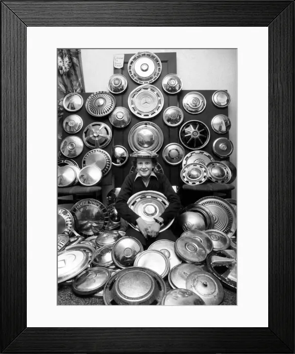 Framed Print : Young David and his collection of 130 caps. He collects hub caps that fly off care near Framed Print : Young David and his collection of 130 caps. He collects hub caps that fly off care near