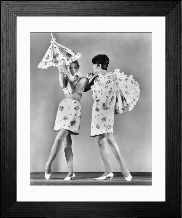 Framed Print : Two models wearing underwear and holding umbrellas. February 1967 P018256 Framed Print : Two models wearing underwear and holding umbrellas. February 1967 P018256