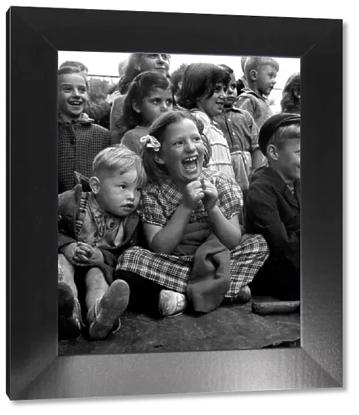 Children Watching Punch and Judy in the Arch Bishops Park in London