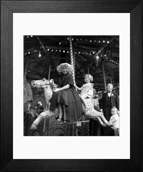 Framed Print : American actress Dolores Gray at Plymouth, riding on the carousel Framed Print : American actress Dolores Gray at Plymouth, riding on the carousel