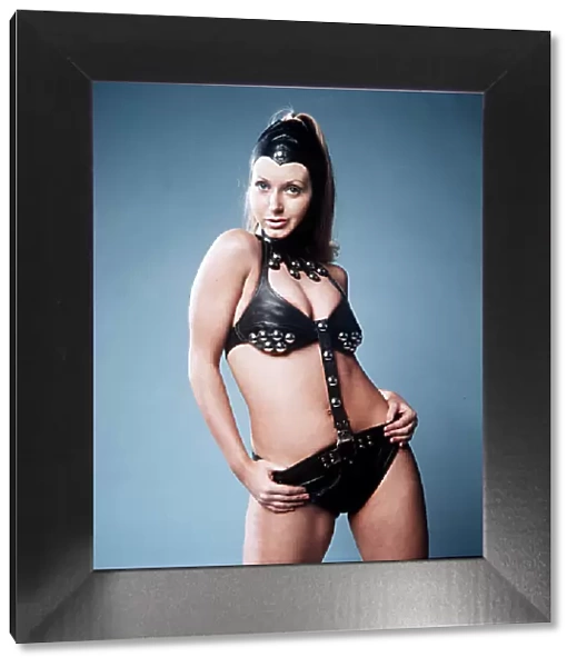 Linda Miller Glamour Model wearing a black leather Bikini with large silver