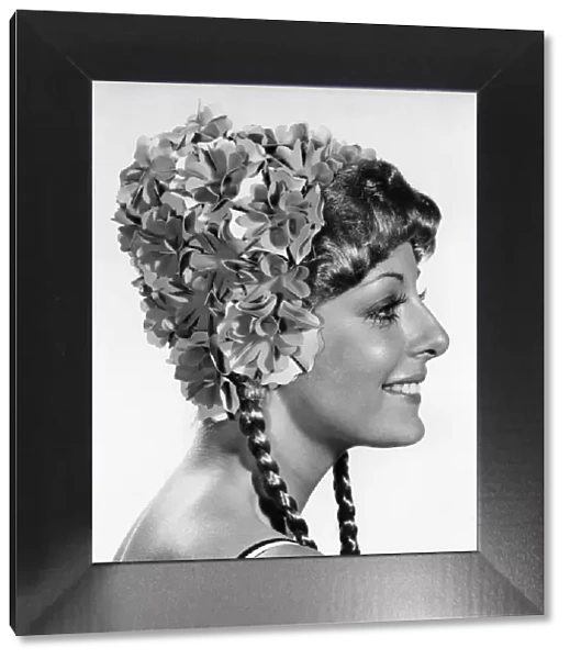 Model wearing a flowery swimcap. October 1970 P017300
