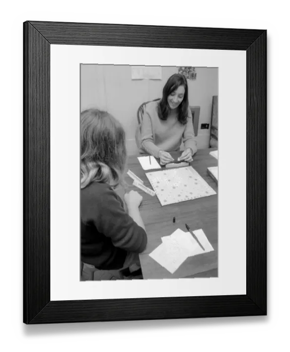 Framed Print : For student Lesley Evans, a game of Scrabble with one of the pupils