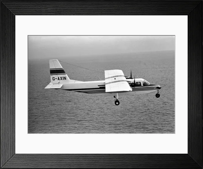 Framed Print : Islander aircraft flies over Cushion Craft Hovercraft, off the Isle of Wight Framed Print : Islander aircraft flies over Cushion Craft Hovercraft, off the Isle of Wight