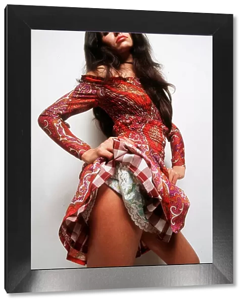 Fashion 1970s Mexican midi dress - model lifting skirt to show thigh