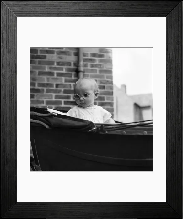Framed Print : Baby wearing glasses. June 1952 C3211
