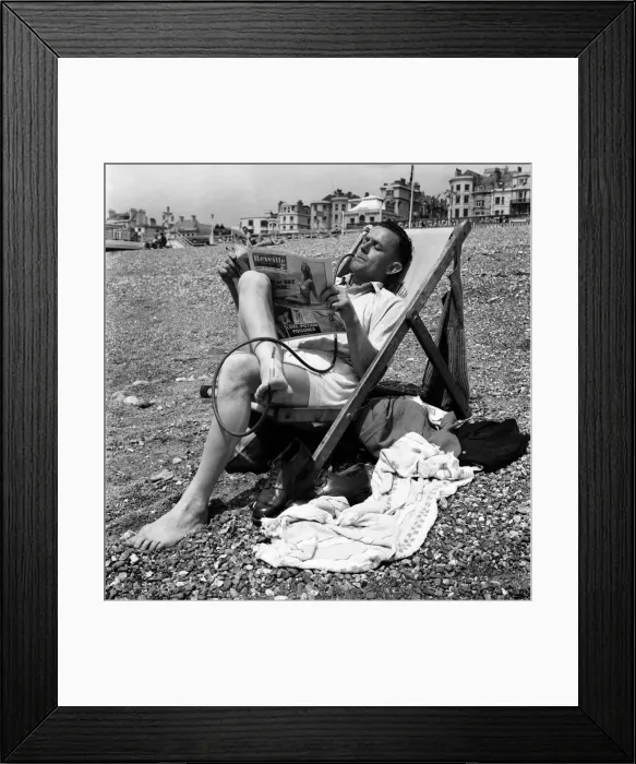 Framed Print : Mr C Reed reading the Reveille paper whilst smoking cigarette in an unusual cigarette Framed Print : Mr C Reed reading the Reveille paper whilst smoking cigarette in an unusual cigarette