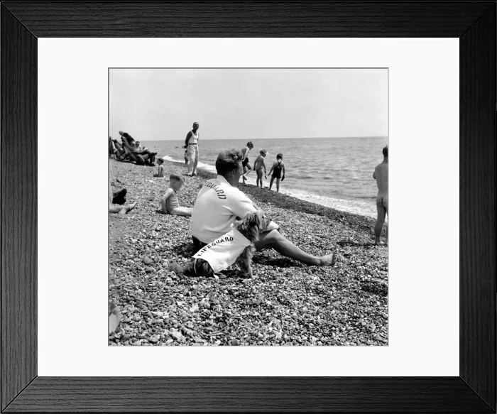Framed Print : Lifeguard George Wheeler and his dog - Brighton Life - Saver. July 1952 C3455 Framed Print : Lifeguard George Wheeler and his dog - Brighton Life - Saver. July 1952 C3455