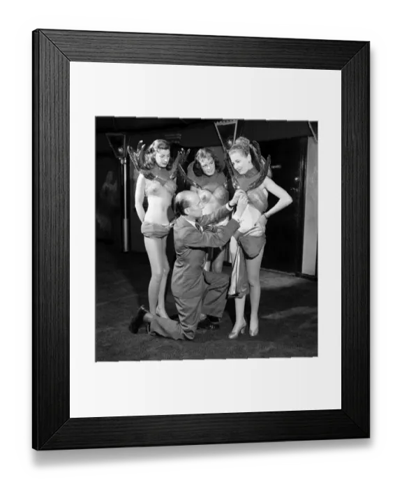 Framed Print : Casino showgirls model their latest costumes which include the invisible bra seen here