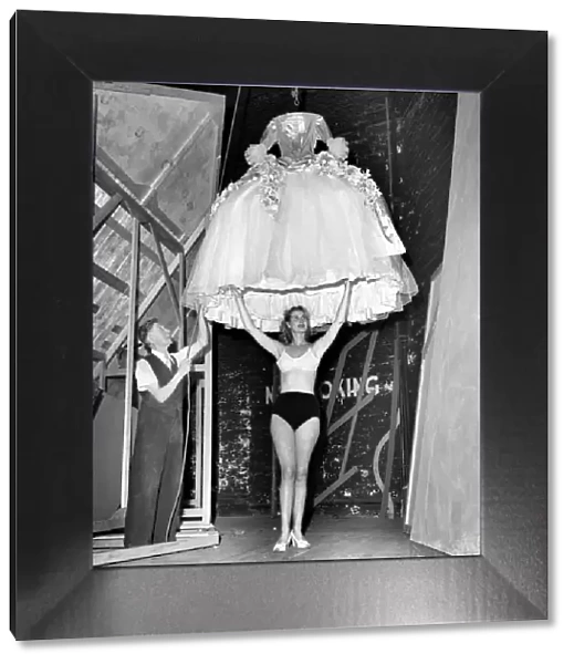Rita Keane, Show girl has her dress lowered over her. September 1953 D5809