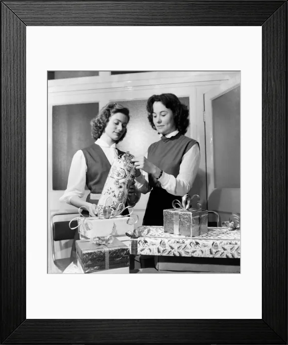 Framed Print : Occupations: Shop Assistants. Shop assistants seen here learning how to wrap Christmas