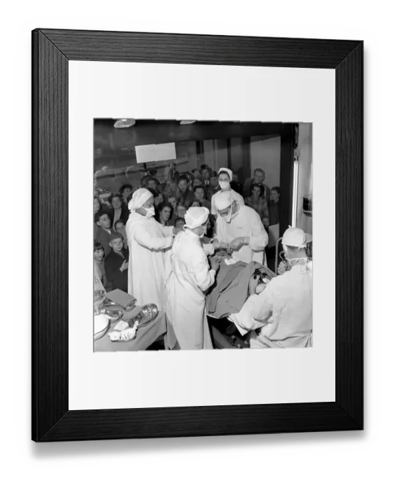 Framed Print : Surgical operation and how a operating theatre works is demonstrated to members of Framed Print : Surgical operation and how a operating theatre works is demonstrated to members of