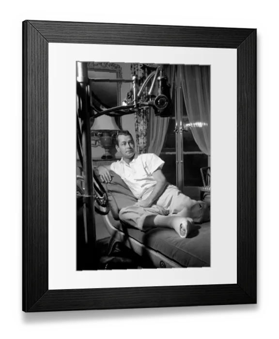 Framed Print : Film star Alan Ladd, who has injured his foot. October 1953 D6473-001