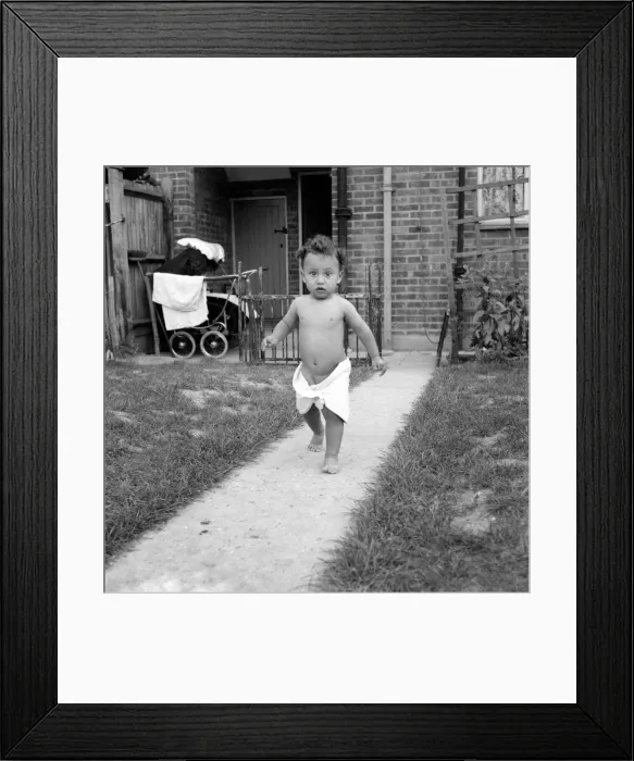 Framed Print : Christopher Wain adopted child seen here in the garden wearing a nappy Framed Print : Christopher Wain adopted child seen here in the garden wearing a nappy