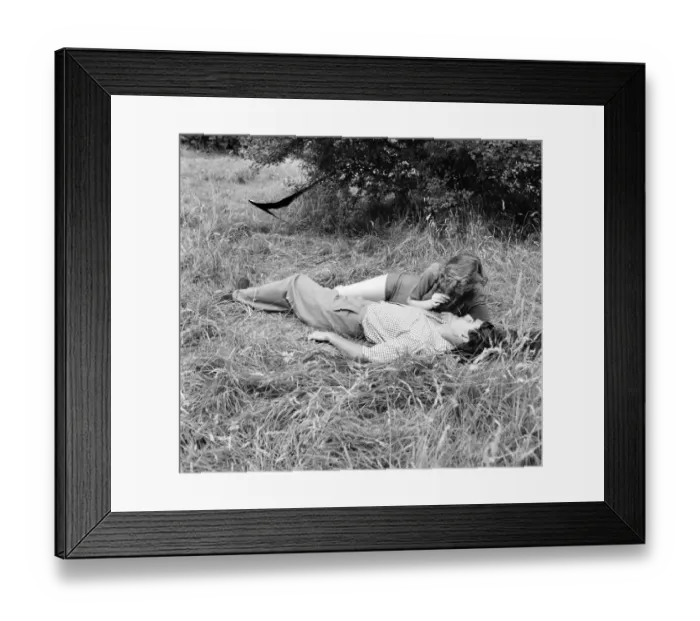 Framed Print : Romance. A young couple in love kissing. August 1953 D5205-002 Framed Print : Romance. A young couple in love kissing. August 1953 D5205-002