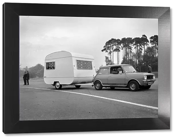 A caravan being towed by a mini clubman car. November 1969 Z10726-001