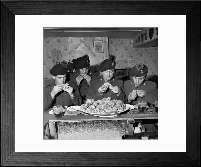 Framed Print : Military Army Food. Soldiers of the Irish Rangers eating pigs trotters in the London Inn