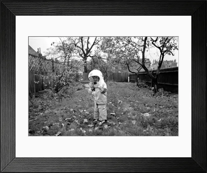 Framed Print : Mark Diment wearing a space-suit in the garden of Chancellor Grove House