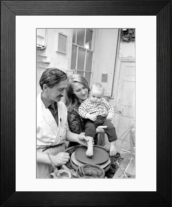 Framed Print : 11 month old Roy Crosland has his footprint cast by making a imprint on the wet clay