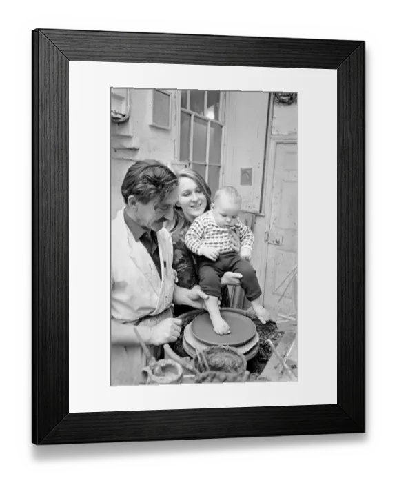 Framed Print : 11 month old Roy Crosland has his footprint cast by making a imprint on the wet clay