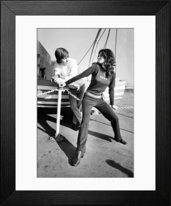 Framed Print : Couple wearing the latest leisurewear pose by a boat. November 1969 Z10672-005