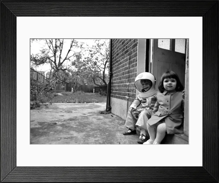 Framed Print : Mark Diment wearing a space-suit in the garden of Chancellor Grove House with his 18