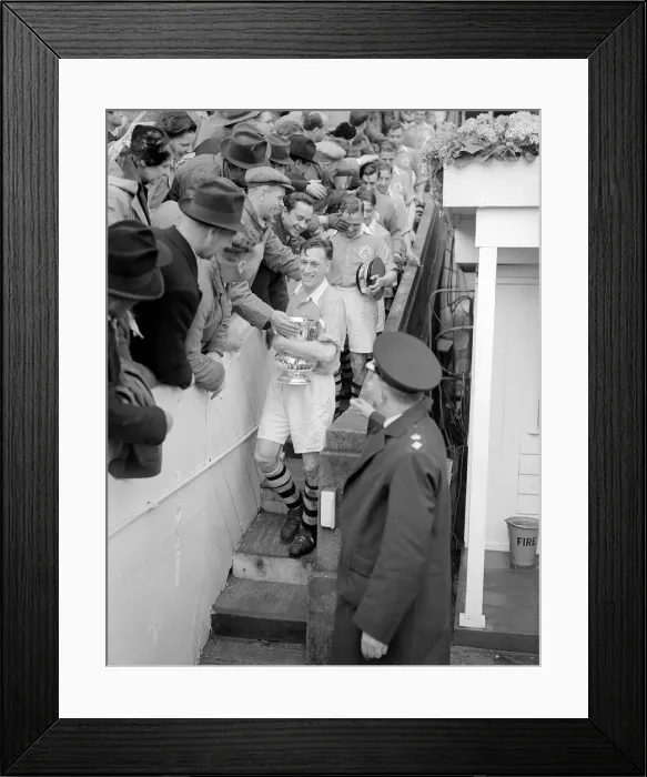 Framed Print : Joe Mercer walks down from the Royal Box at Wembley after collecting the FA Cup for
