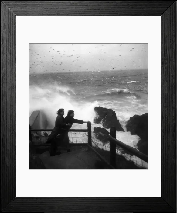 Framed Print : Lillian Wills and Mauri Wearne in gale at Mevagissey Cornwall. November 1952 C5817