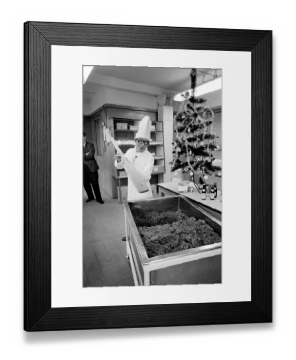Framed Print : Arthur Askey, the famous little comedian stirred up a giant Christmas pudding today at a Framed Print : Arthur Askey, the famous little comedian stirred up a giant Christmas pudding today at a