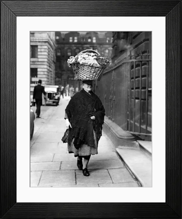 Framed Print : This 68 year-old flower seller of Liverpool presents an unusual picture as she carries