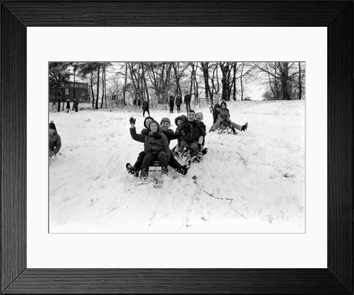 Framed Print : Weather snow scenes at Hampstead Heath: Winter: Everyone enjoys the first London snow Framed Print : Weather snow scenes at Hampstead Heath: Winter: Everyone enjoys the first London snow