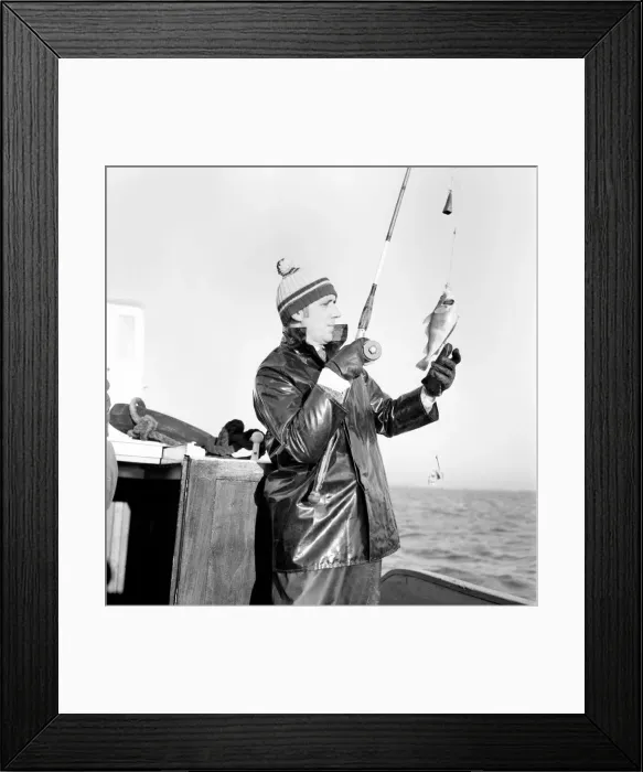 Framed Print : Sport: Angling: Police Constable Derek Rogers, fishing off the Isle of Wight
