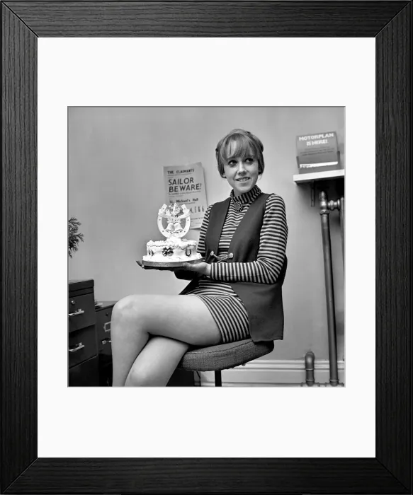Framed Print : Humour: Woman posing with a wedding cake pulling funny facial expressions Framed Print : Humour: Woman posing with a wedding cake pulling funny facial expressions