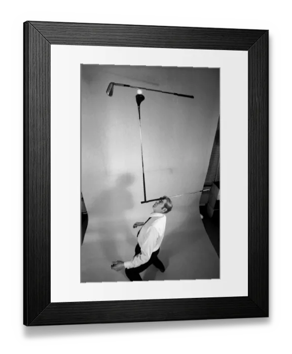 Framed Print : Entertainment: Juggling: Juggler Rob Murray doing his thing with three golf clubs