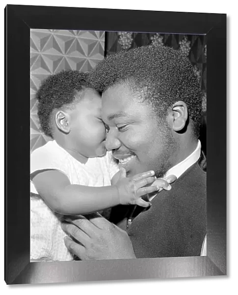 Father with his toddler son. December 1969 Z11609-001