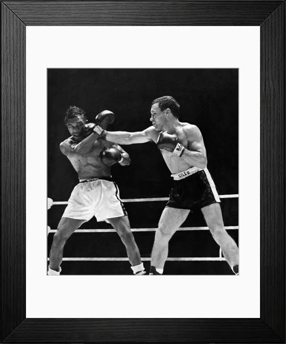 Framed Print : Lennie Matthews takes a hefty punch from Dave Charnley during their lightweight bout