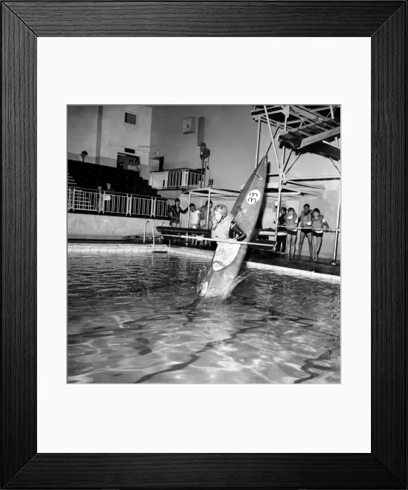 Framed Print : Young boy takes a canoe of a 10 feet high diving board at Bournemouth swimming pool Framed Print : Young boy takes a canoe of a 10 feet high diving board at Bournemouth swimming pool